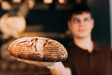 Holding a round bread
