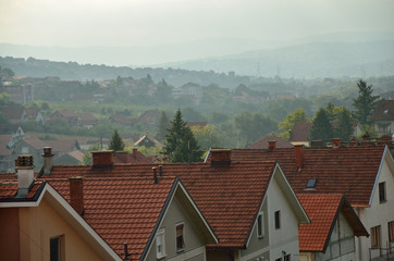 Suburban panorama in morning mist