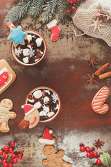 Hot Chocolate with marshmallows and gingerbread cookies in a Christmas setting
