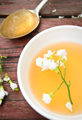 orange jelly with white flowers on wooden background