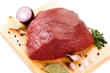 Fresh raw beef on cutting board on white background 