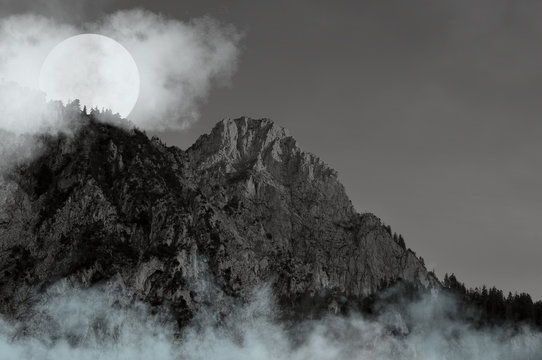 The Alps in the cloudy night - black and white photo