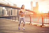 beautiful asian woman running in New york at sunset time.