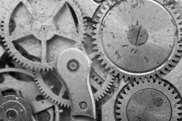 Fototapeta na wymiar Black-and-white Metal Cogwheels in Oldest Clockwork, Macro.