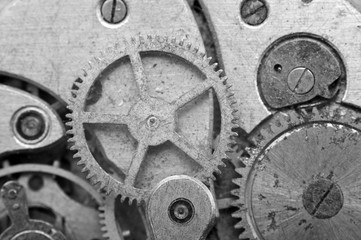 Black-and-white Metal Cogwheels in Oldest Clockwork, Macro.