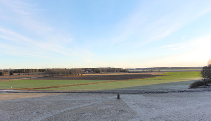Fototapeta premium The big stones standing in the snow field in winter