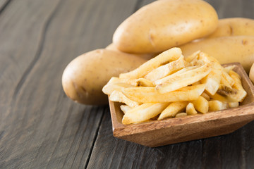 french fries on wood background