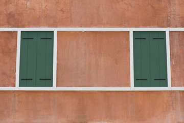 Green wooden window on vintage home European style.
