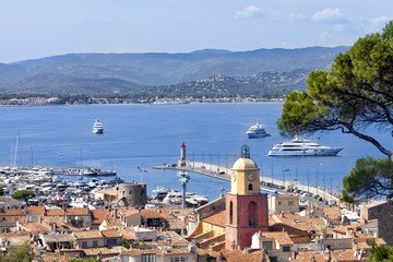 Fototapeta na wymiar Top view of famous village St Tropez in French Riviera and sea with super yachts