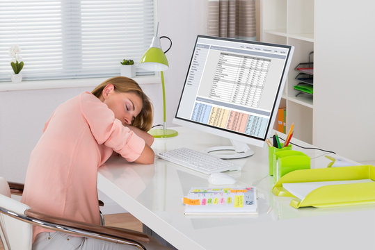 Woman Sleeping At Desk
