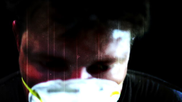 Spastic man in breathing mask horror clip 