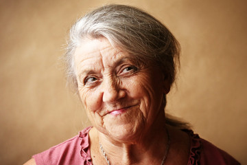 Smile granny face on a brown background 