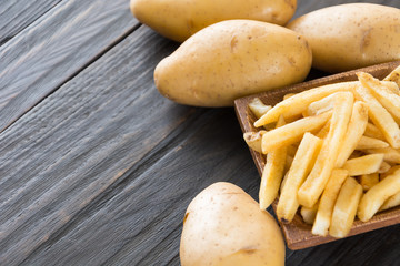 french fries on wood background