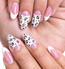 Beautiful woman's nails with french manicure