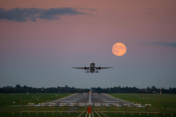 Plane take-off under the full moon © panoramarx