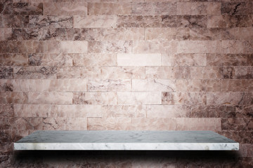 Empty top of natural stone shelves and stone wall background