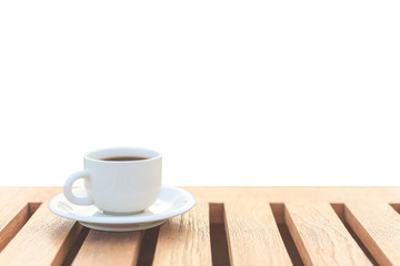 Coffee cup on wood table isolated on white background