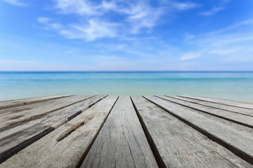 Fototapeta na wymiar Top of wood table and view of tropical beach