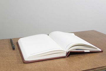 blank notebook on wooden table, business concept