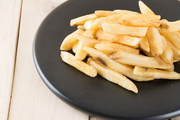 french fries on wood background