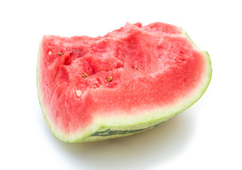 a piece of watermelon on a white background