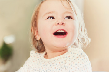 Happy toddler girl with smiling