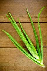Fresh Aloe Vera on Wood Background.