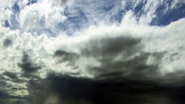 Clouds 1111: Dramatic time lapse storm clouds float through a blue sky.