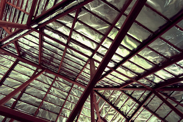 roof with steel beam and silver foil insulation heat on ceiling