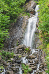 Fototapeta na wymiar Beautiful waterfall mountains stone water creek
