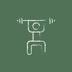 Man with barbell icon drawn in chalk.