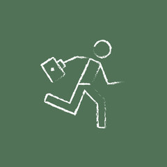Paramedic running with first aid kit icon drawn in chalk.