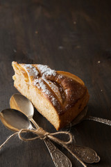 Apple pie on wooden table. Charlotte.