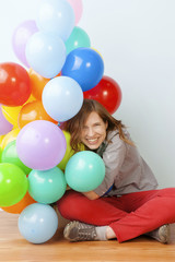 Fototapeta na wymiar Woman Hugging Balloons