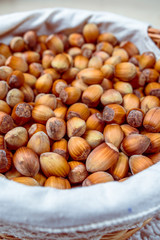 Many hazel nuts in basket