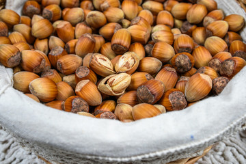 Many hazel nuts in basket
