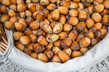 Many hazel nuts in wicker basket