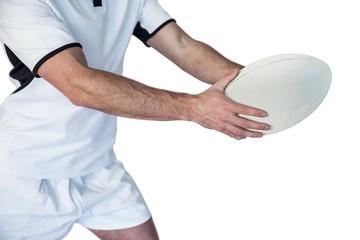 Obraz premium Midsection of rugby player holding the ball