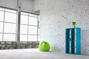 Interesting design on a background of white bricks with green decor