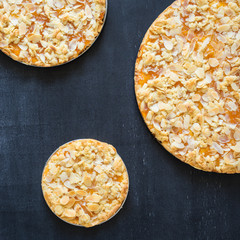 Homemade apricot jam tarts baked in different sizes