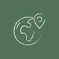 Globe with pointer icon drawn in chalk.