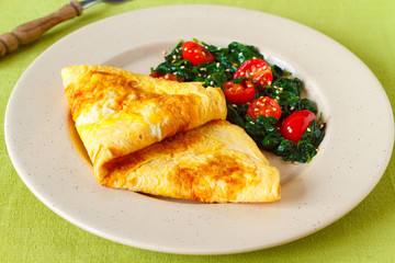 baked omelette with spinach and cherry tomatoes