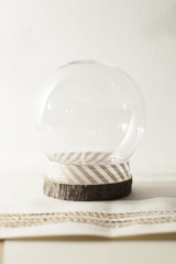 snow globe on cream background