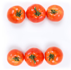 Tomatoes. Whole and  half on white