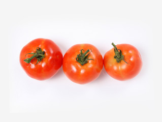 Tomatoes. Whole and  half on white