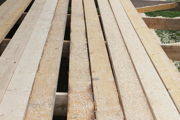 Construction of a floor from pine boards on a veranda
 outdoors