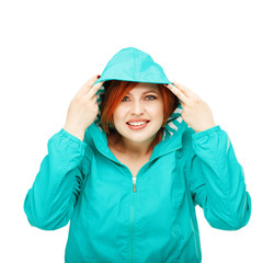 Portrait of a young beautiful girl in a jacket with a hood isola