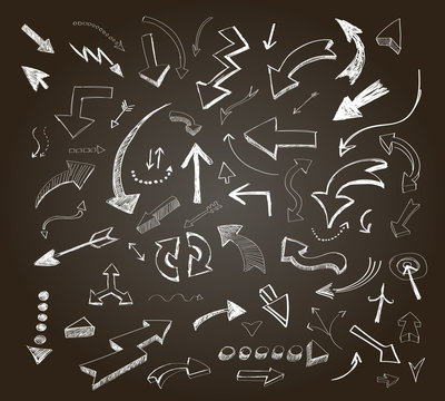 Hand drawn arrows icons set on a chalkboard 