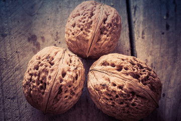 Walnuts on a wooden table.