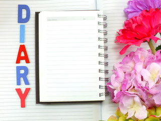 note book diary and beautiful flower bouquet background